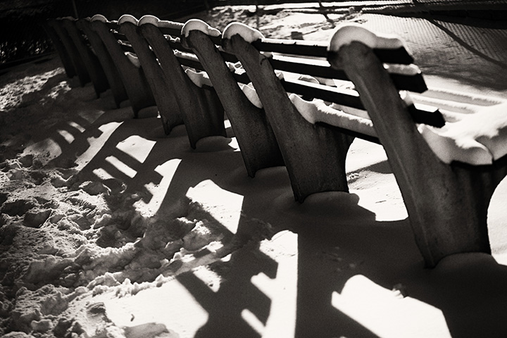 snow covered park bench